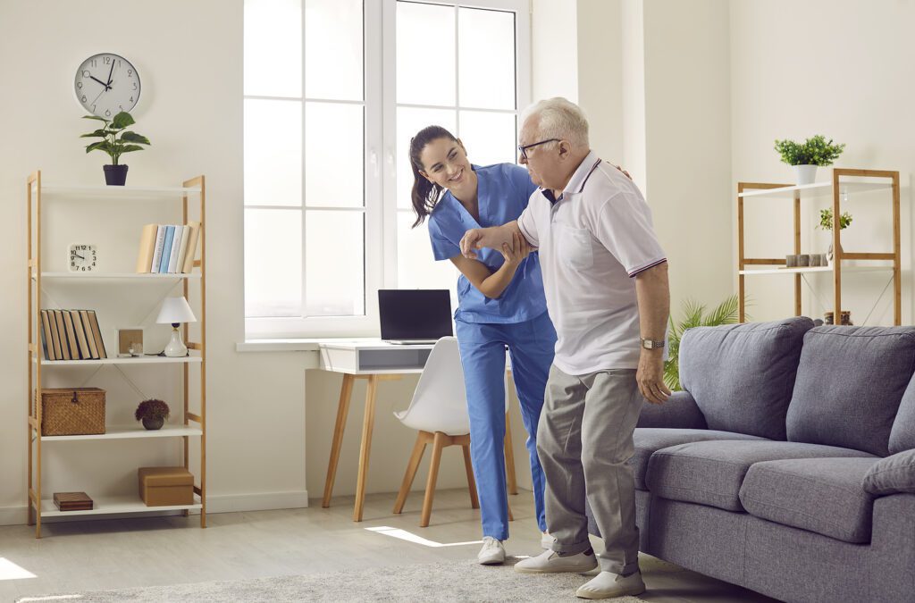 Friendly female caregiver caring for elderly man.