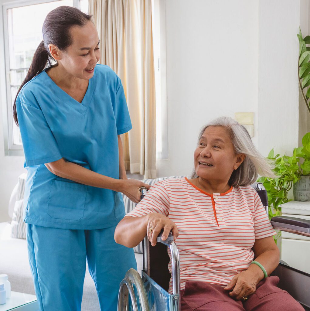 Woman PSW assisting women in wheelchair